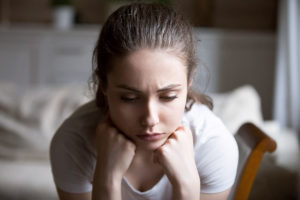 teeanage girl pondering how recognizing toxic relationships can be beneficial