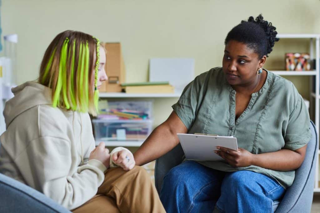 Teen talking to someone else about their struggles in school