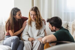 therapist discussing with adolescent girl the benefits of anxiety treatment for teens