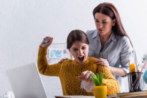 teenage daughter having angry outburst as mother attempts to share 5 tips to help control anger